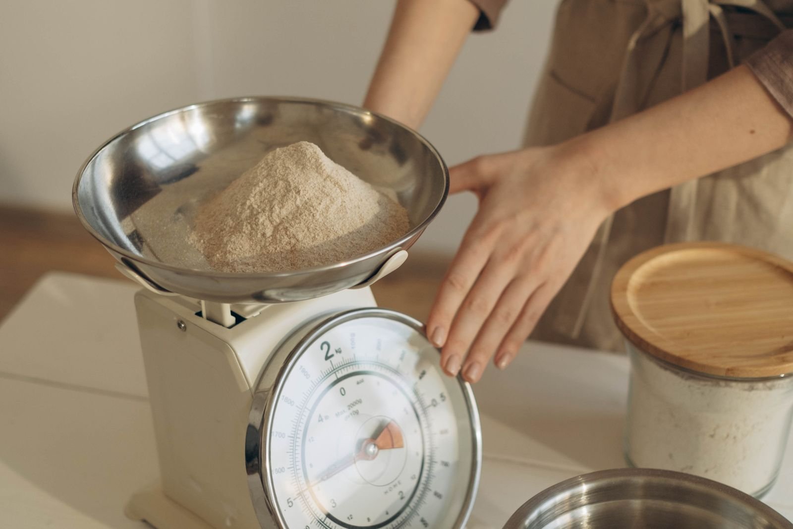 Weighing flour on a kitchen scale