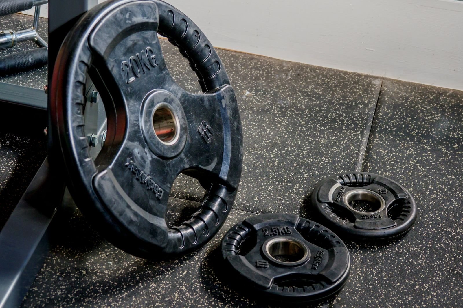 Weight plates on a gym floor