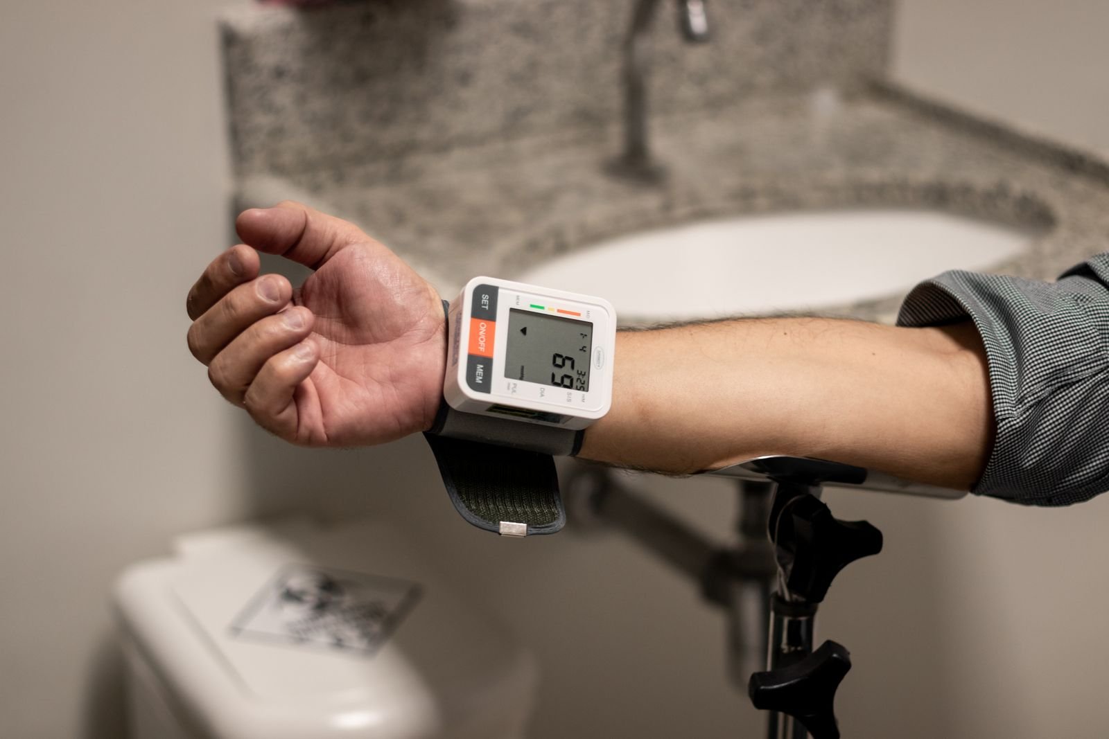 Wrist blood pressure monitor in use