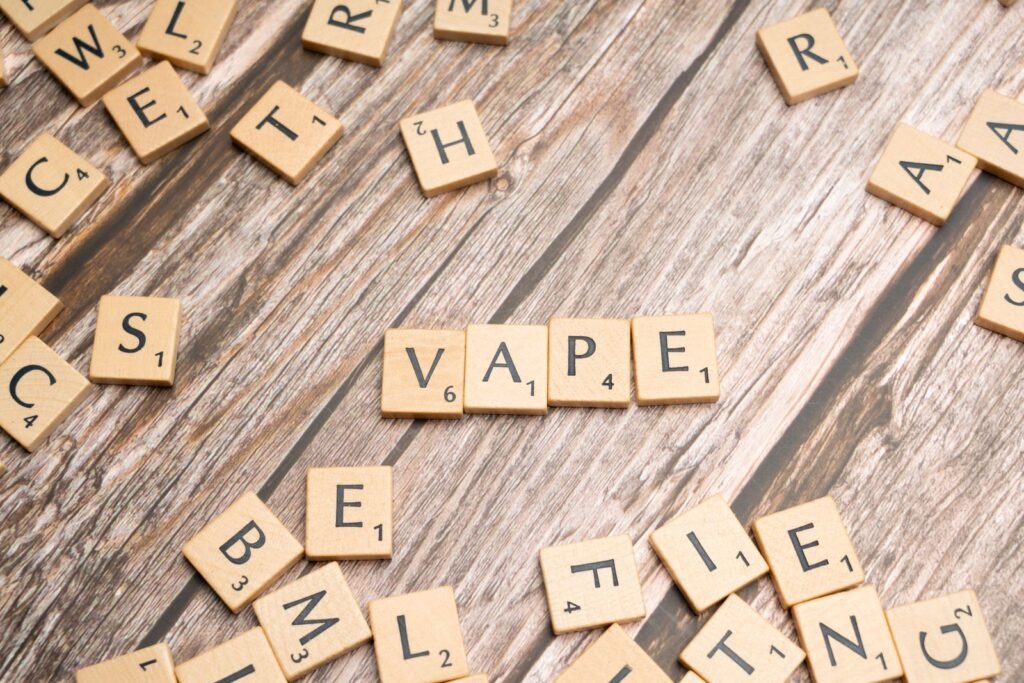 Scrabble tiles spelling vape, illustrating vaping vs smoking